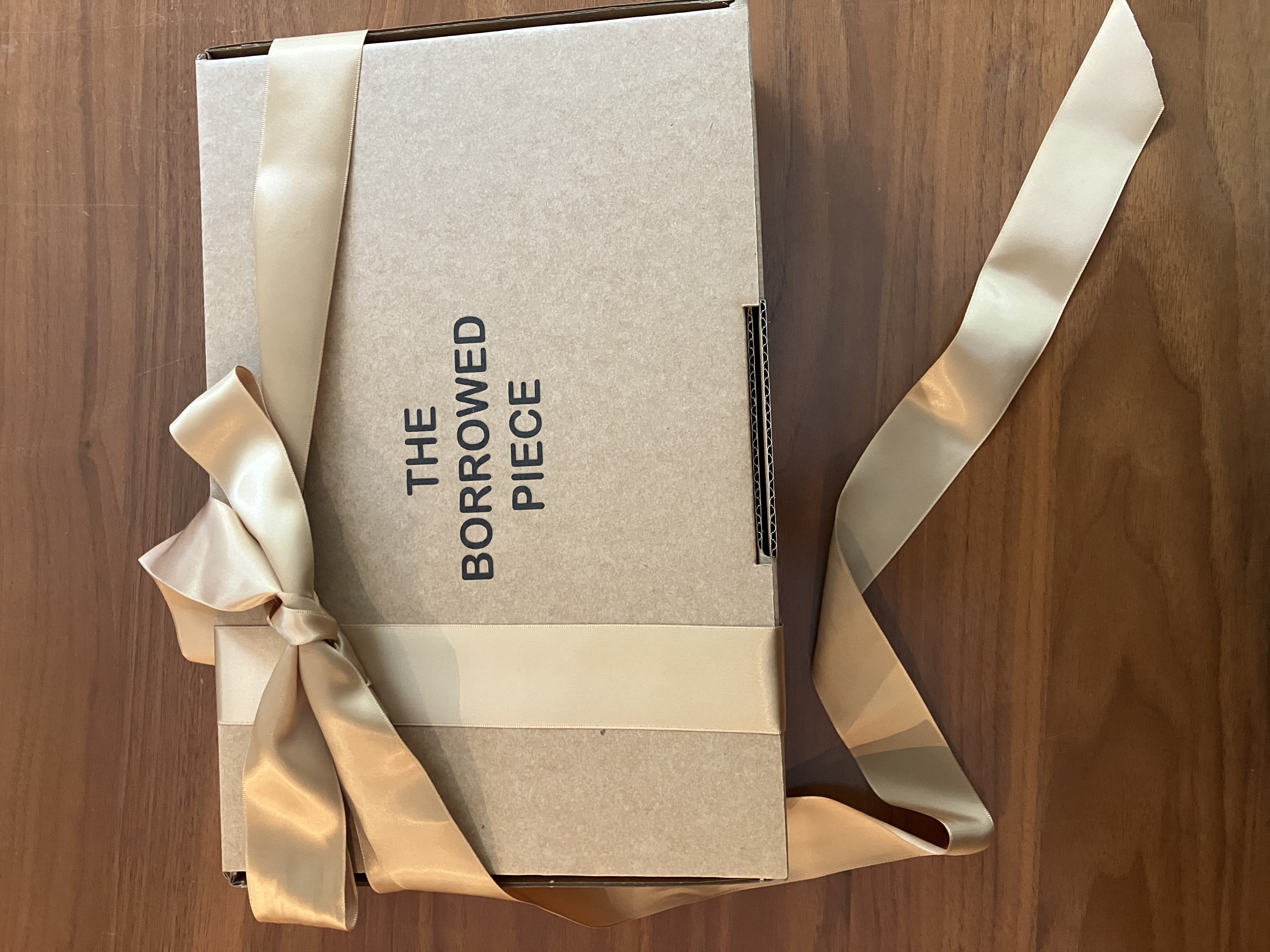 A puzzle parcel wrapped in kraft paper and twine